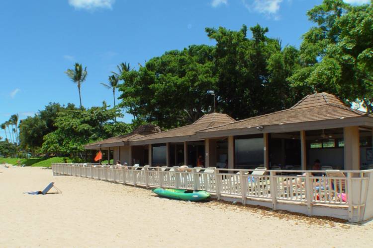 Beach-level view of the Maui Eldorado beach cabana beside the sand and ocean